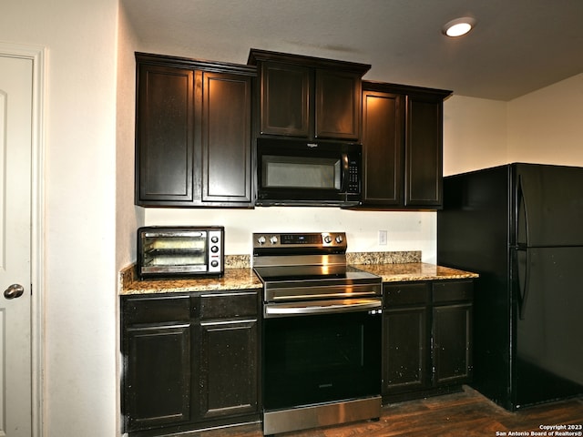 11719 Claudette St, San Antonio, TX 78252 - kitchen with black appliances, dark wood-type flooring, light stone countertops, and recessed lighting