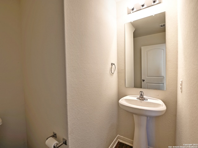11719 Claudette St, San Antonio, TX 78252 - bathroom with a sink