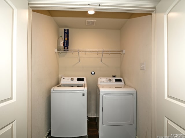 11719 Claudette St, San Antonio, TX 78252 - clothes washing area featuring washing machine and clothes dryer
