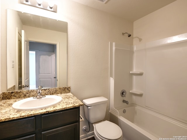 11719 Claudette St, San Antonio, TX 78252 - bathroom with toilet, vanity, and washtub / shower combination