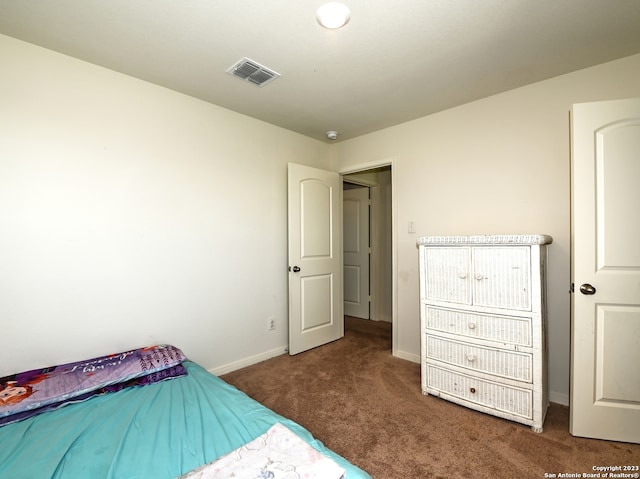 11719 Claudette St, San Antonio, TX 78252 - carpeted bedroom with baseboards