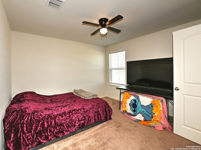 11719 Claudette St, San Antonio, TX 78252 - bedroom with carpet flooring, baseboards, and ceiling fan
