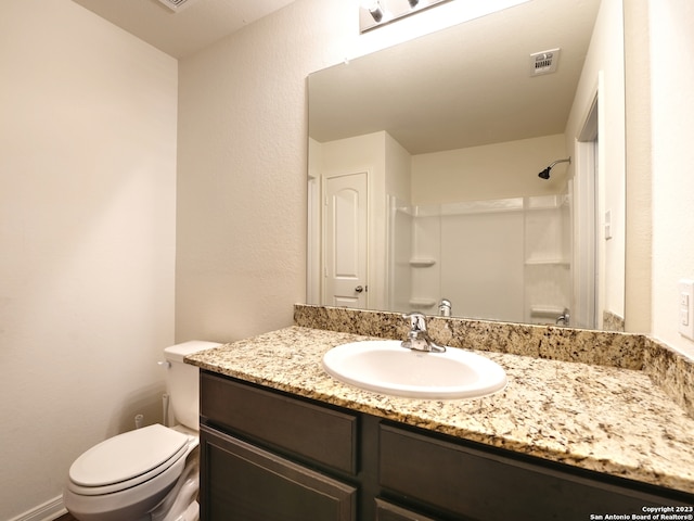 11719 Claudette St, San Antonio, TX 78252 - full bath featuring toilet, a shower, and vanity