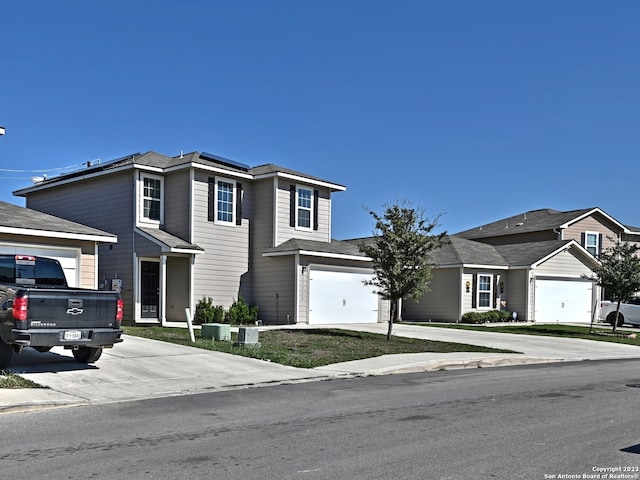11719 Claudette St, San Antonio, TX 78252 - traditional home featuring concrete driveway and a garage