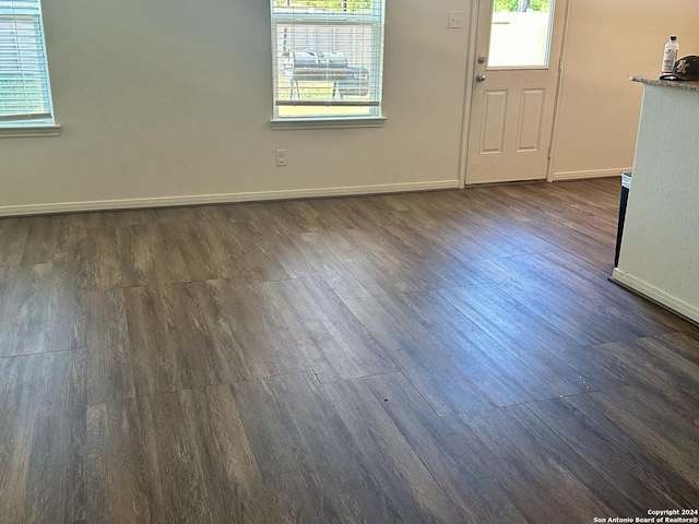 11719 Claudette St, San Antonio, TX 78252 - empty room with baseboards and dark wood-style floors