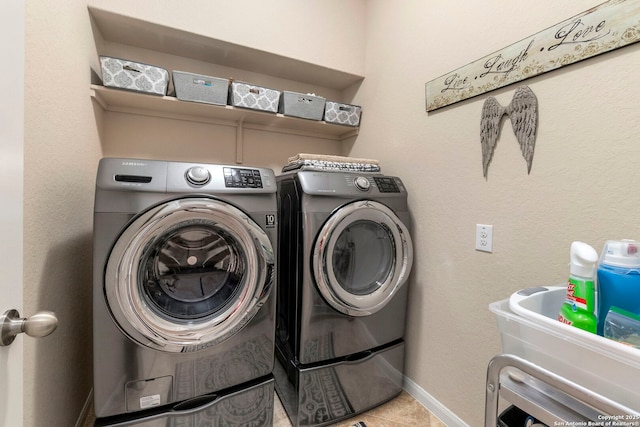 929 Cypress Ml, New Braunfels, TX 78130 - clothes washing area with washing machine and clothes dryer, baseboards, and tile patterned flooring