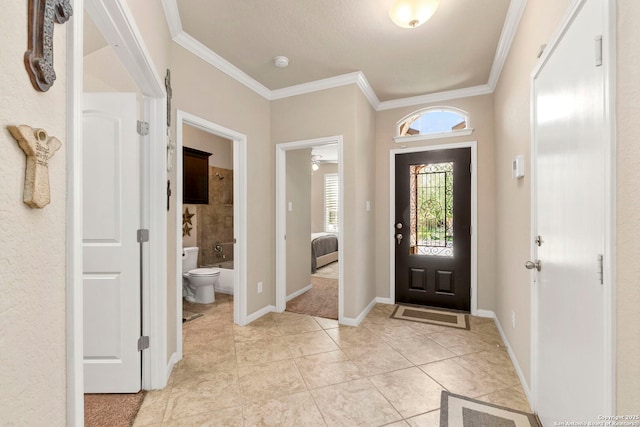 929 Cypress Ml, New Braunfels, TX 78130 - foyer featuring ornamental molding, light tile patterned flooring, and baseboards