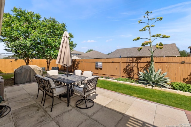 929 Cypress Ml, New Braunfels, TX 78130 - view of patio featuring a fenced backyard, outdoor dining area, and grilling area
