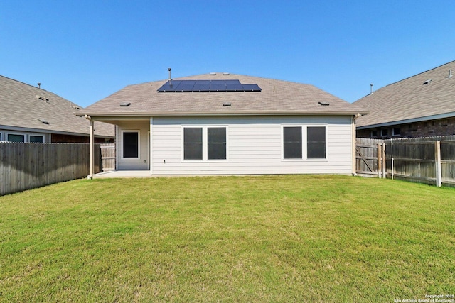 8911 Rancher Pl, Seguin, TX 78155 - back of house with roof mounted solar panels and a patio area