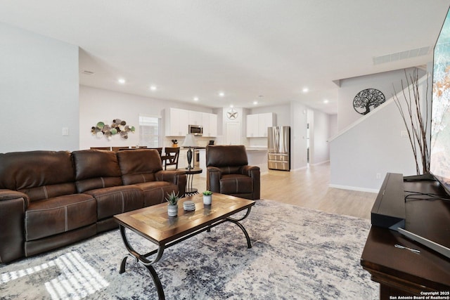 8911 Rancher Pl, Seguin, TX 78155 - living area featuring light wood finished floors, recessed lighting, and baseboards