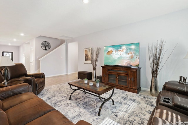 8911 Rancher Pl, Seguin, TX 78155 - living room featuring light wood-style floors, baseboards, and recessed lighting