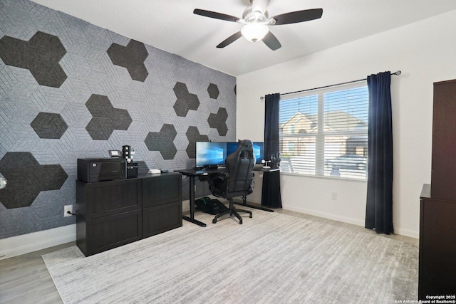 8911 Rancher Pl, Seguin, TX 78155 - office area with baseboards, ceiling fan, light wood-type flooring, and an accent wall