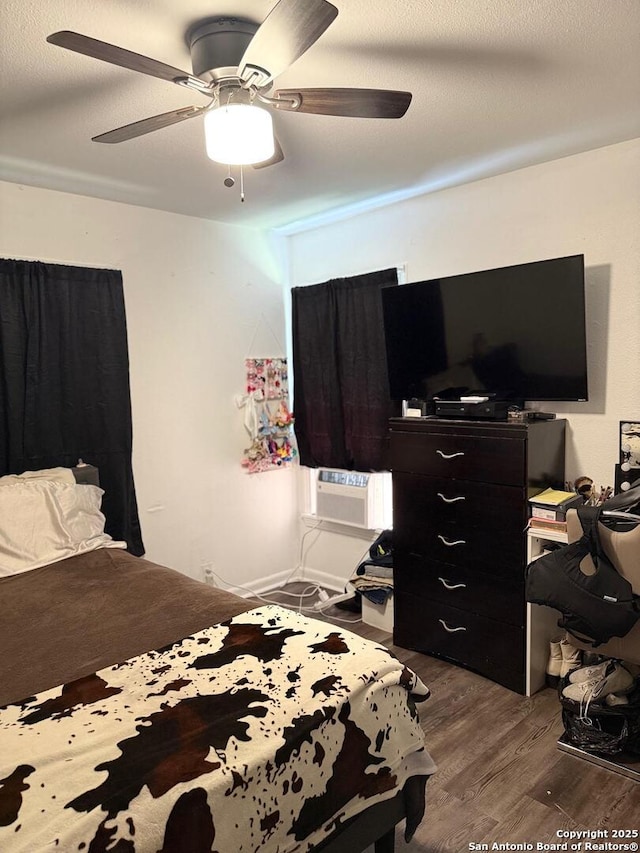 2902 Christian Dr, San Antonio, TX 78222 - bedroom with dark wood finished floors and ceiling fan