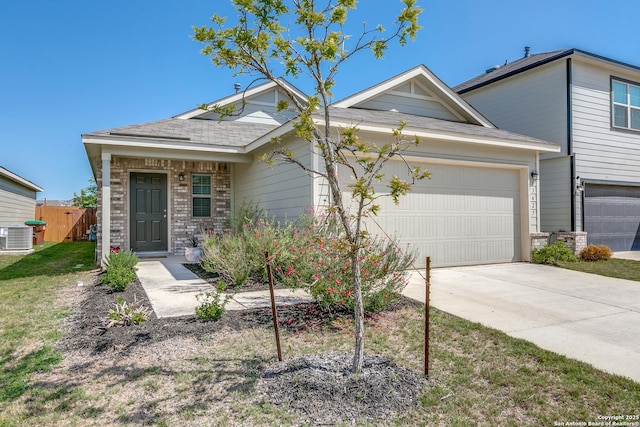 13627 Crossbow, San Antonio, TX 78253 - view of front of property with an attached garage, concrete driveway, cooling unit, and brick siding