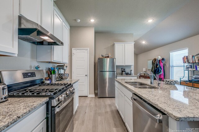 13627 Crossbow, San Antonio, TX 78253 - kitchen featuring appliances with stainless steel finishes, a sink, extractor fan, white cabinets, and light wood-type flooring