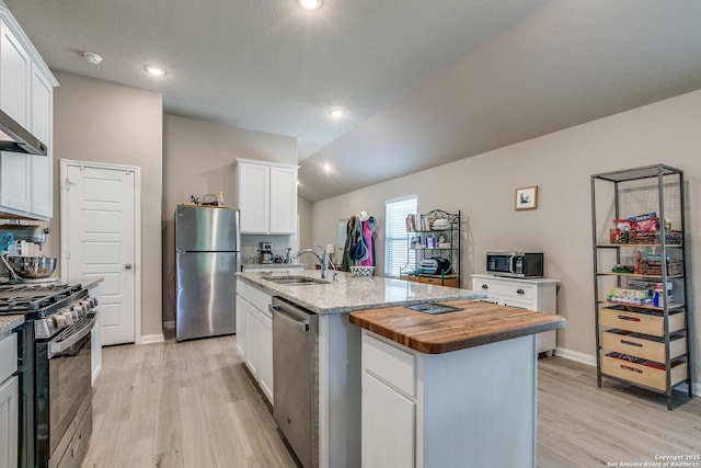 13627 Crossbow, San Antonio, TX 78253 - kitchen with stainless steel appliances, a sink, light wood-style floors, white cabinets, and recessed lighting
