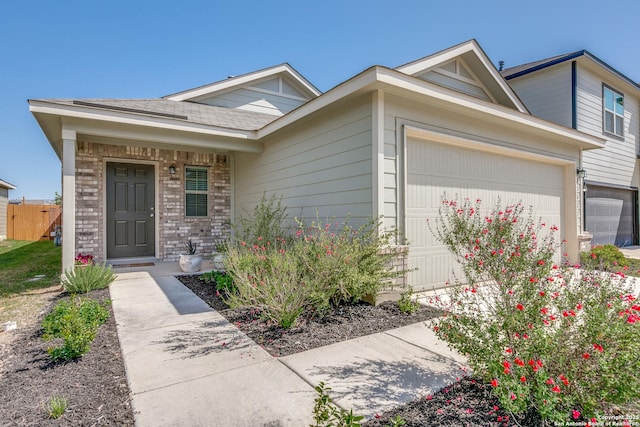 13627 Crossbow, San Antonio, TX 78253 - view of front facade featuring an attached garage and brick siding