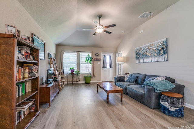 13627 Crossbow, San Antonio, TX 78253 - living room with a ceiling fan, light wood-style flooring, lofted ceiling, and baseboards