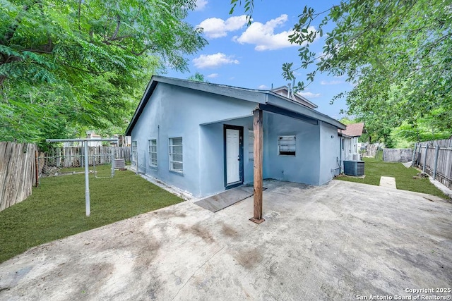 235 Altgelt, San Antonio, TX 78201 - back of house with stucco siding, a patio area, and central air condition unit