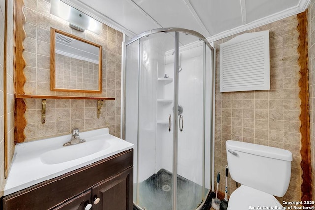 235 Altgelt, San Antonio, TX 78201 - bathroom featuring tile walls, a stall shower, vanity, and toilet
