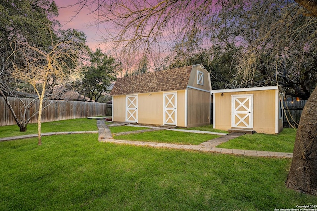 9206 Dancove Dr, San Antonio, TX 78250 - outdoor structure at dusk featuring a shed and an outdoor structure