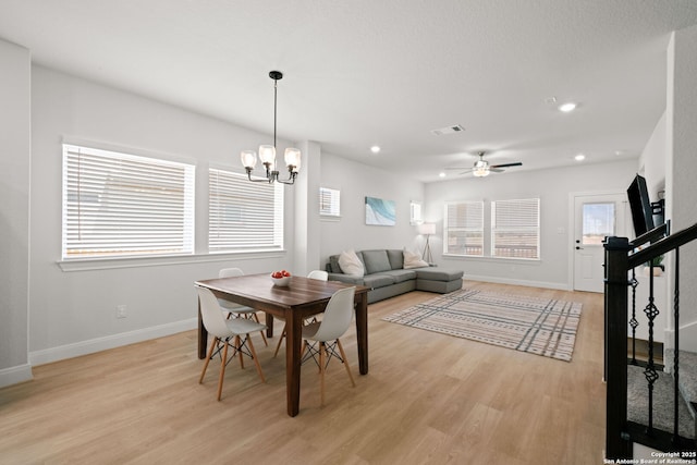 dining space featuring baseboards, light wood-style floors, a chandelier, recessed lighting, and ceiling fan