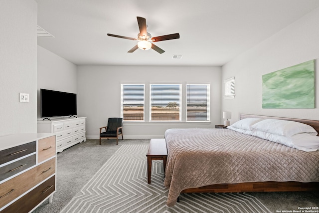 bedroom featuring carpet, baseboards, and ceiling fan