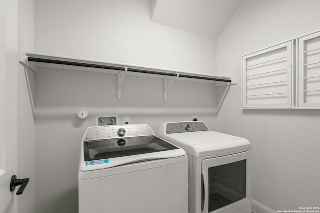 laundry room with washer and dryer