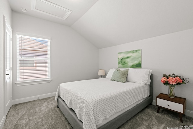 bedroom featuring attic access, carpet floors, vaulted ceiling, and baseboards