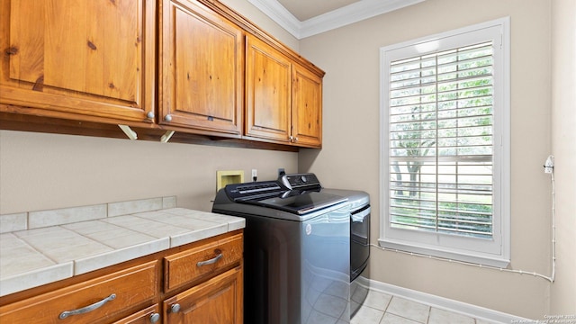 24935 Pecan Crk, San Antonio, TX 78255 - washroom with cabinet space, ornamental molding, separate washer and dryer, light tile patterned floors, and baseboards