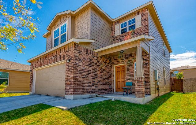 414 Harvest Pt, Selma, TX 78154 - view of front of home with an attached garage, brick siding, and driveway
