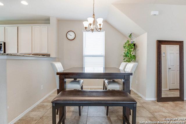 414 Harvest Pt, Selma, TX 78154 - dining space featuring a chandelier, lofted ceiling, baseboards, recessed lighting, and light tile patterned flooring