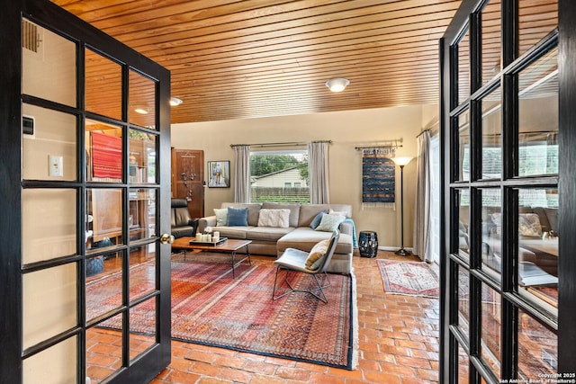 635 Brightwood Pl, San Antonio, TX 78209 - living area with wooden ceiling, brick floors, french doors, and baseboards