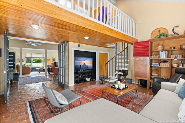 635 Brightwood Pl, San Antonio, TX 78209 - living area featuring brick floors, stairs, and ceiling fan