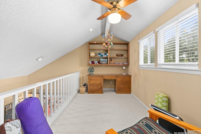 635 Brightwood Pl, San Antonio, TX 78209 - carpeted office with a ceiling fan, lofted ceiling, a textured ceiling, baseboards, and built in desk