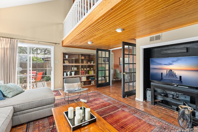 635 Brightwood Pl, San Antonio, TX 78209 - living area with french doors, brick flooring, and a high ceiling