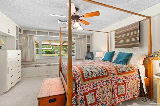 635 Brightwood Pl, San Antonio, TX 78209 - carpeted bedroom featuring a textured ceiling and a ceiling fan