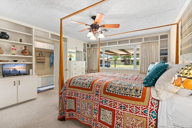 635 Brightwood Pl, San Antonio, TX 78209 - bedroom featuring a textured ceiling, light carpet, and a ceiling fan