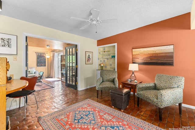635 Brightwood Pl, San Antonio, TX 78209 - sitting room featuring ceiling fan, baseboards, and a textured ceiling