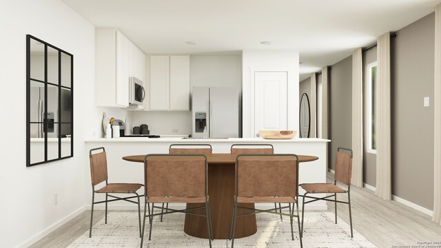 3423 Rock Mill Dm, San Antonio, TX 78245 - kitchen featuring fridge with ice dispenser, stainless steel microwave, light wood-style floors, a peninsula, and light countertops
