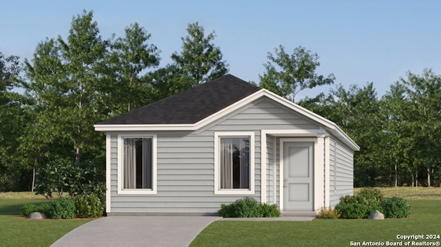 3610 Glade Crk, San Antonio, TX 78245 - view of front facade featuring a front lawn, roof with shingles, and an outbuilding