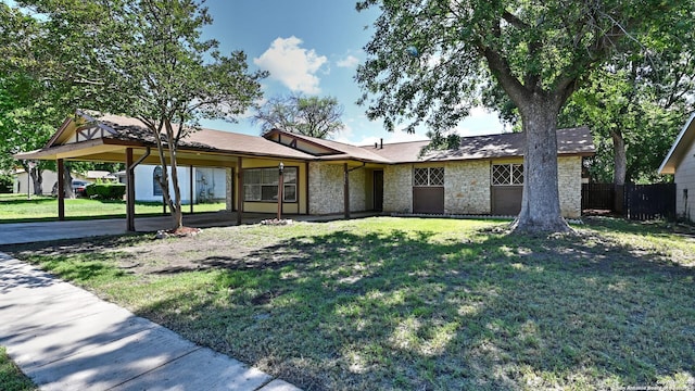 8526 Glen Breeze, San Antonio, TX 78239 - view of front facade featuring stone siding and a carport