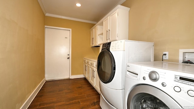 8526 Glen Breeze, San Antonio, TX 78239 - washroom with washer and dryer, crown molding, cabinet space, dark wood-type flooring, and baseboards