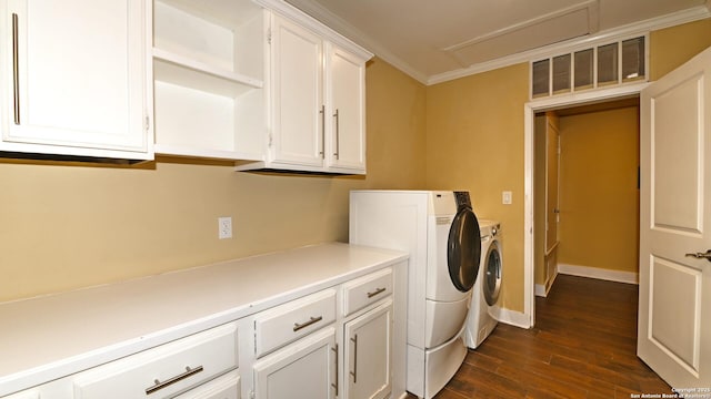 8526 Glen Breeze, San Antonio, TX 78239 - laundry area with washing machine and clothes dryer, cabinet space, dark wood-type flooring, crown molding, and baseboards