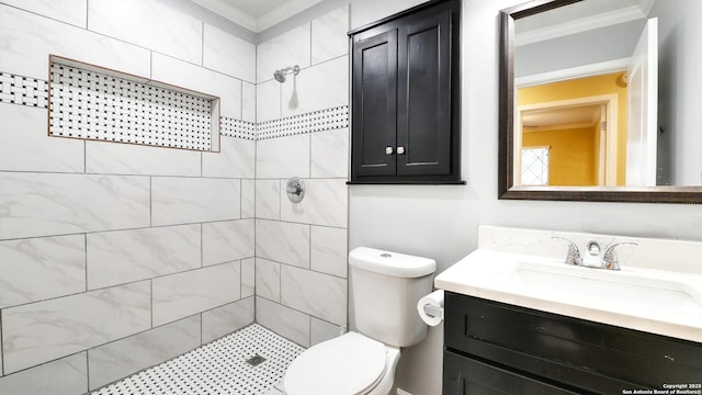 8526 Glen Breeze, San Antonio, TX 78239 - bathroom with ornamental molding, tiled shower, vanity, and toilet