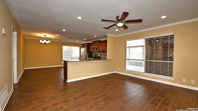 8526 Glen Breeze, San Antonio, TX 78239 - kitchen with stainless steel appliances, a chandelier, crown molding, plenty of natural light, and recessed lighting