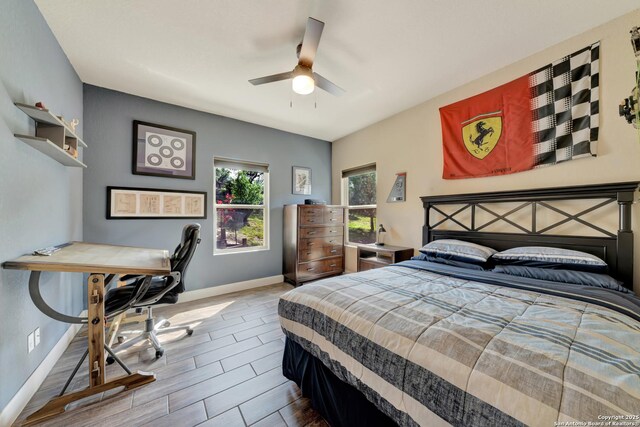211 Comal Run, Bulverde, TX 78163 - bedroom with baseboards, ceiling fan, an office area, and wood finish floors