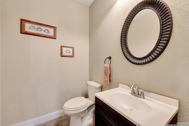 211 Comal Run, Bulverde, TX 78163 - half bathroom with vanity, toilet, tile patterned floors, and baseboards