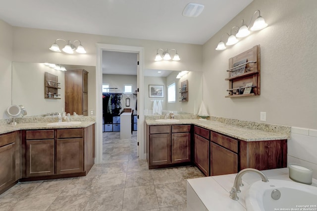 211 Comal Run, Bulverde, TX 78163 - full bathroom featuring two vanities and a tub