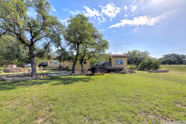 211 Comal Run, Bulverde, TX 78163 - view of green lawn featuring a wooden deck